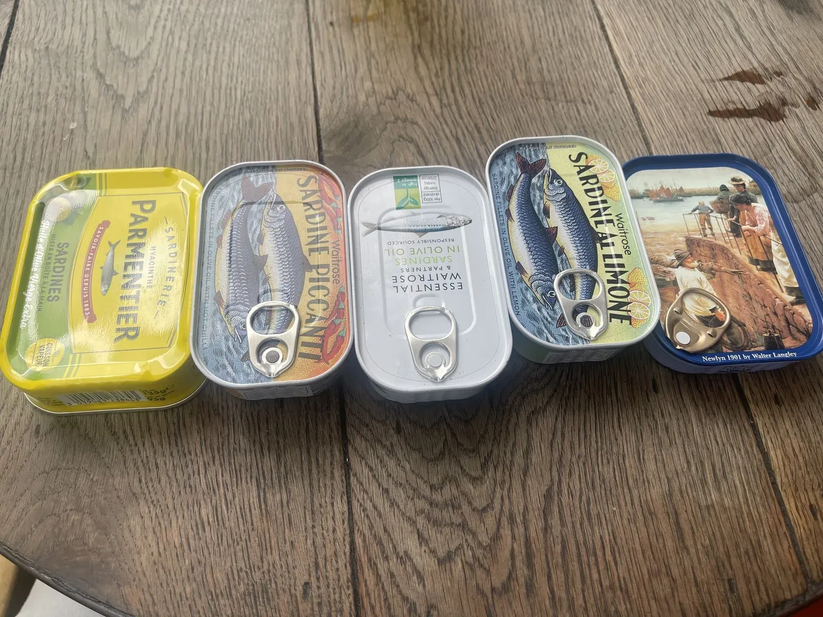 A row of sardine tins on the collector's kitchen table